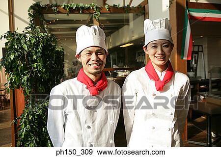 Portrait of two chefs standing in front of a restaurant View Large Photo Image Stock Photo - Portrait of two chefs standing in front of a restaurant. Fotosearch