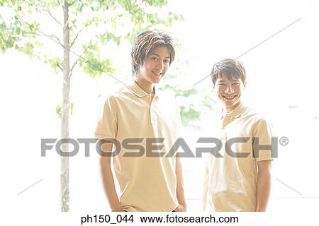 Portrait of two waiters smiling View Large Photo Image Picture - Portrait of two waiters smiling. Fotosearch