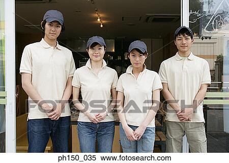 Portrait of two waiters with two waitresses standing in front of a restaurant View Large Photo Image Stock Photography - Portrait of two waiters with two waitresses standing in front of a restaurant. Fotosearch