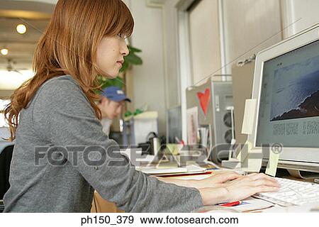 Side profile of a businesswoman working on a computer View Large Photo Image Stock Photo - Side profile of a businesswoman working on a computer. Fotosearch