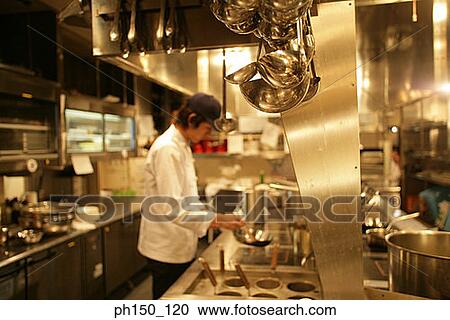 Side profile of a chef preparing food in the kitchen View Large Photo Image Stock Image - Side profile of a chef preparing food in the kitchen. Fotosearch