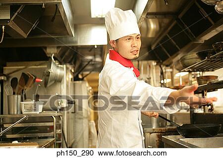 Side profile of a chef preparing food in the kitchen View Large Photo Image Stock Image - Side profile of a chef preparing food in the kitchen. Fotosearch