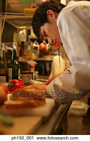 Side profile of a chef working in the kitchen View Large Photo Image Stock Image - Side profile of a chef working in the kitchen. Fotosearch