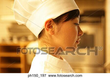 Side profile of a female chef View Large Photo Image Stock Photo - Side profile of a female chef. Fotosearch