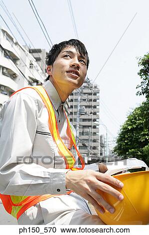 Side profile of a traffic cop holding a hardhat View Large Photo Image Stock Image - Side profile of a traffic cop holding a hardhat. Fotosearch