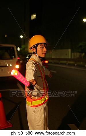 Side profile of a traffic cop holding a nightstick View Large Photo Image Stock Image - Side profile of a traffic cop holding a nightstick. Fotosearch