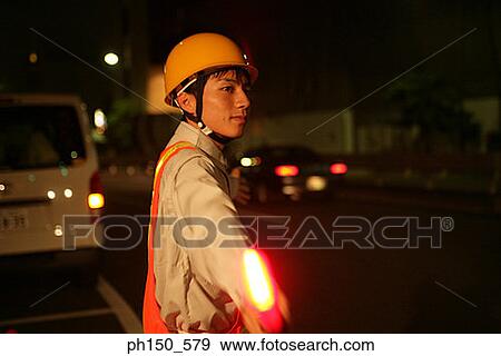 Side profile of a traffic cop holding a nightstick View Large Photo Image Stock Photo - Side profile of a traffic cop holding a nightstick. Fotosearch