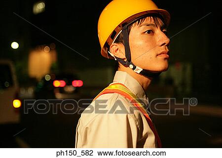 Side profile of a traffic cop looking away View Large Photo Image Stock Image - Side profile of a traffic cop looking away. Fotosearch