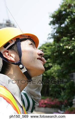 Side profile of a traffic cop looking up View Large Photo Image Stock Photo - Side profile of a traffic cop looking up. Fotosearch