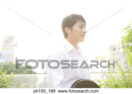 Stock Photo - Side profile of a waiter. Fotosearch