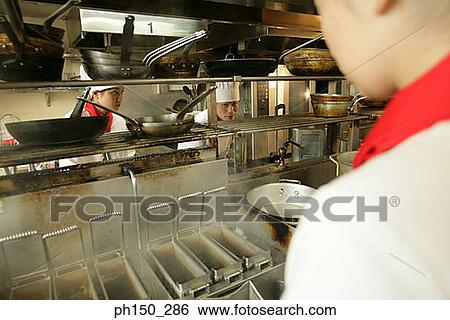 Three chefs in the kitchen View Large Photo Image Stock Photograph - Three chefs in the kitchen. Fotosearch