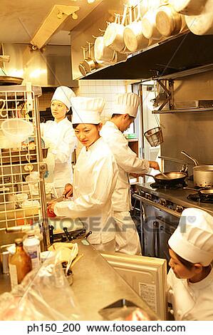 Three female chefs and one male chef in the kitchen View Large Photo Image Stock Image - Three female chefs and one male chef in the kitchen. Fotosearch