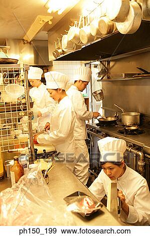 Three female chefs and one male chef in the kitchen View Large Photo Image Stock Photo - Three female chefs and one male chef in the kitchen. Fotosearch