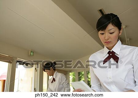 Two waitresses in a restaurant View Large Photo Image Stock Image - Two waitresses in a restaurant. Fotosearch
