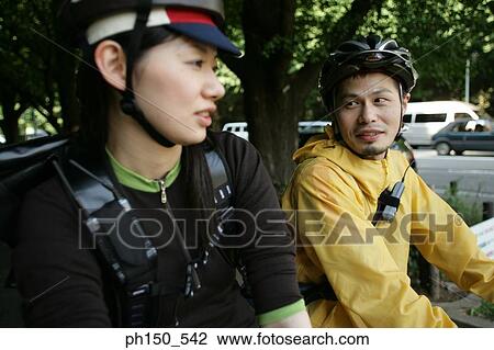 Young man looking at a young woman View Large Photo Image Stock Image - Young man looking at a young woman. Fotosearch