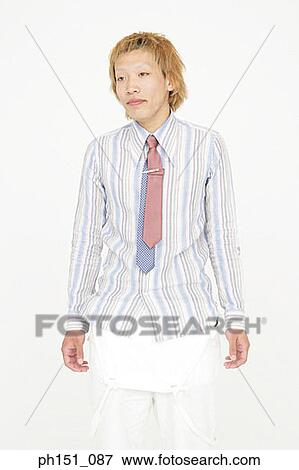 Close-up of a teenage boy looking away View Large Photo Image Stock Photo - Close-up of a teenage boy looking away. Fotosearch