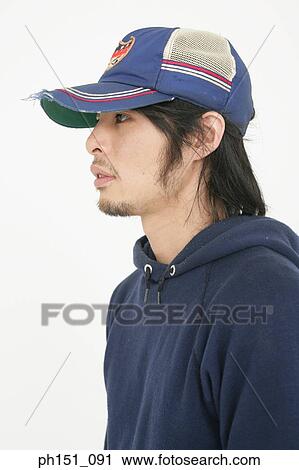 Close-up of a young man thinking View Large Photo Image Stock Image - Close-up of a young man thinking. Fotosearch