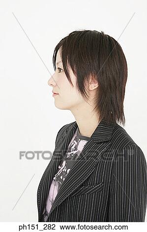 Stock Image - Close-up of a young woman looking away. Fotosearch