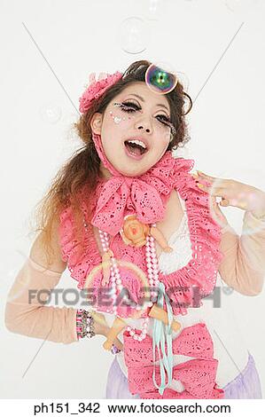 Stock Image - Close-up of a young woman posing. Fotosearch