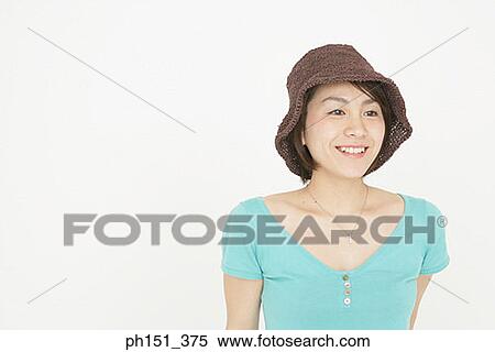 Stock Photography - Close-up of a young woman smiling. Fotosearch