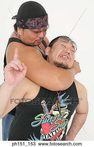 Close-up of two mid adult men wrestling View Large Photo Image Stock Image - Close-up of two mid adult men wrestling. Fotosearch