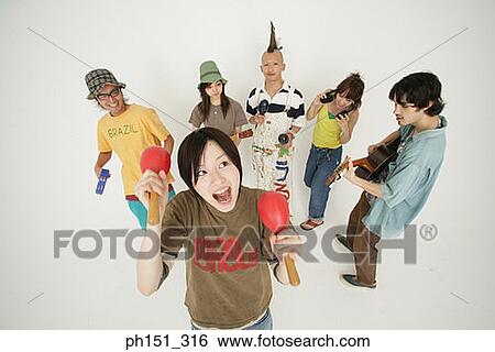 High angle view of three young couples playing musical instruments View Large Photo Image Stock Photograph - High angle view of three young couples playing musical instruments. Fotosearch