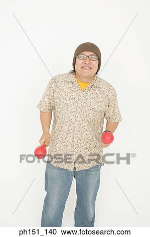 Portrait of a mid adult man holding maracas and smiling View Large Photo Image Stock Image - Portrait of a mid adult man holding maracas and smiling. Fotosearch