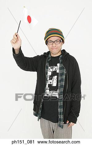 Portrait of a young man holding a Japanese Flag View Large Photo Image Stock Image - Portrait of a young man holding a Japanese Flag. Fotosearch