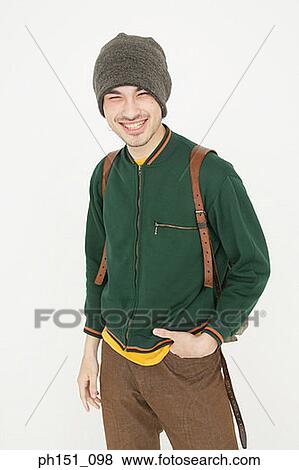 Portrait of a young man looking cheerful View Large Photo Image Stock Photo - Portrait of a young man looking cheerful. Fotosearch