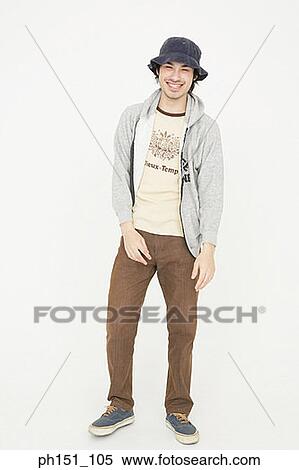 Stock Photography - Portrait of a young man looking cheerful. Fotosearch