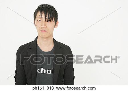 Portrait of a young man looking serious View Large Photo Image Stock Image - Portrait of a young man looking serious. Fotosearch