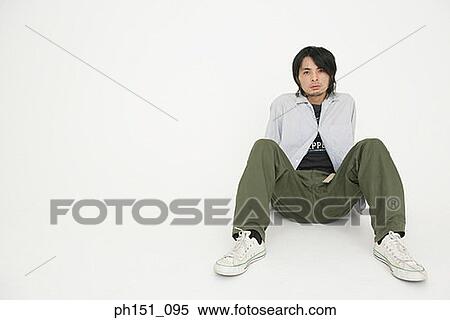 Portrait of a young man looking serious View Large Photo Image Stock Photography - Portrait of a young man looking serious. Fotosearch