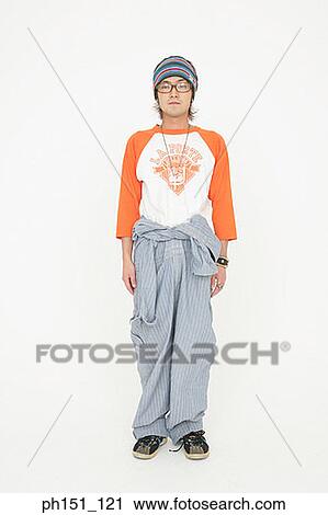 Stock Image - Portrait of a young man posing. Fotosearch