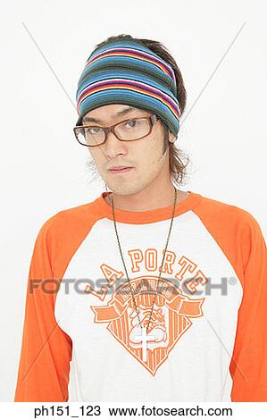 Stock Image - Portrait of a young man posing. Fotosearch