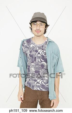 Portrait of a young man posing View Large Photo Image Stock Photo - Portrait of a young man posing. Fotosearch