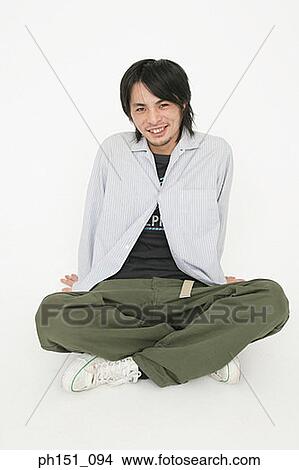 Portrait of a young man smiling View Large Photo Image Picture - Portrait of a young man smiling. Fotosearch
