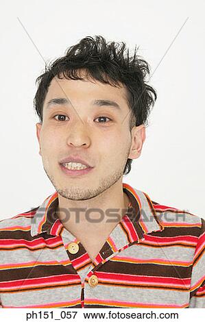 Stock Photo - Portrait of a young man smiling. Fotosearch