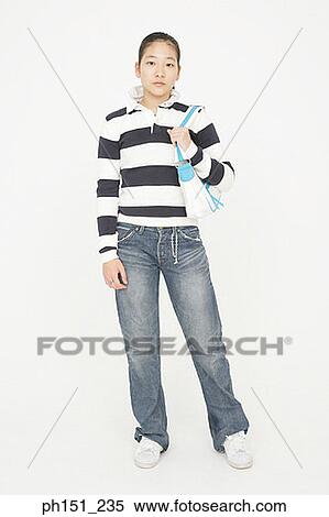 Portrait of a young woman carrying a hand bag View Large Photo Image Stock Photography - Portrait of a young woman carrying a hand bag. Fotosearch