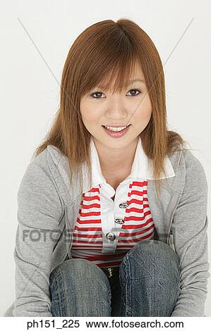 Portrait of a young woman smiling View Large Photo Image Stock Photography - Portrait of a young woman smiling. Fotosearch