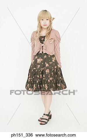 Portrait of a young woman standing View Large Photo Image Stock Photograph - Portrait of a young woman standing. Fotosearch