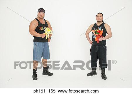 Portrait of two mid adult men holding bouquets of flowers View Large Photo Image Stock Photography - Portrait of two mid adult men holding bouquets of flowers. Fotosearch