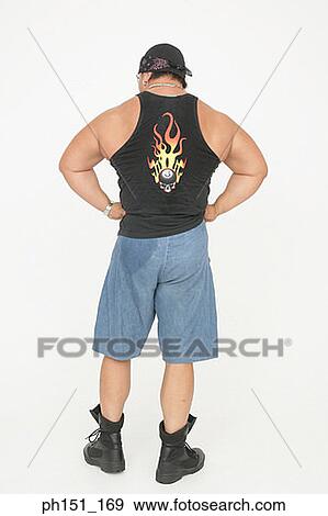 Rear view of a man flexing his muscles View Large Photo Image Stock Photo - Rear view of a man flexing his muscles. Fotosearch