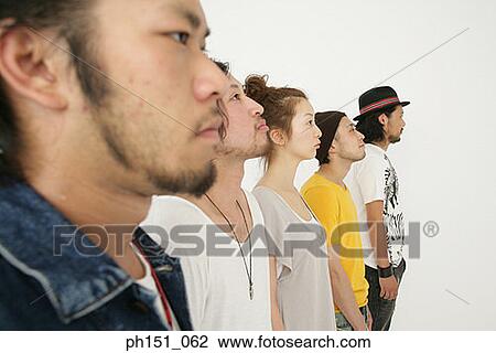 Stock Image - Rows of young men and a young woman. Fotosearch