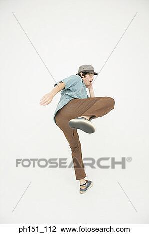 Side profile of a young man practicing tai chi View Large Photo Image Stock Image - Side profile of a young man practicing tai chi. Fotosearch