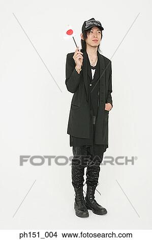 Young man holding a Japanese flag View Large Photo Image Picture - Young man holding a Japanese flag. Fotosearch
