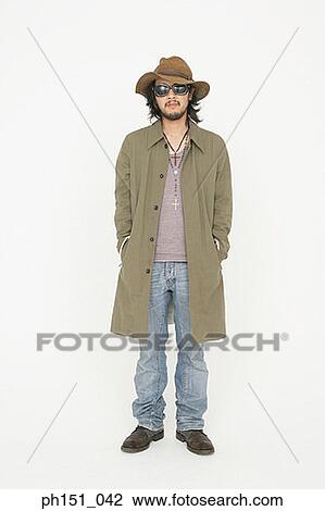 Young man posing with his hands in his pockets View Large Photo Image Stock Image - Young man posing with his hands in his pockets. Fotosearch