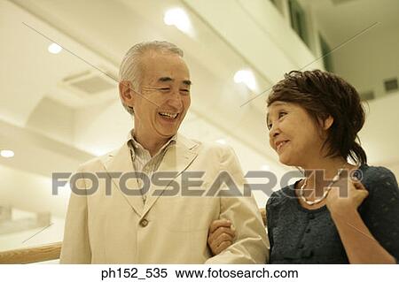 Close-up of a senior couple smiling View Large Photo Image Stock Photography - Close-up of a senior couple smiling. Fotosearch