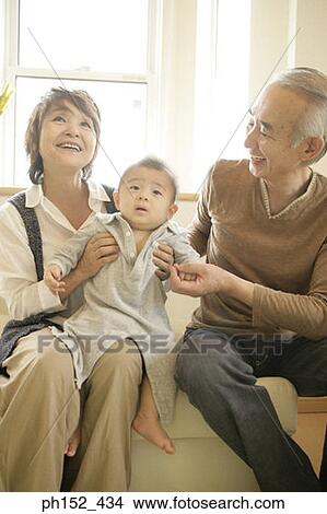 Close-up of a senior couple with their grandson View Large Photo Image Picture - Close-up of a senior couple with their grandson. Fotosearch