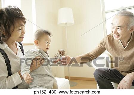 Close-up of a senior couple with their grandson View Large Photo Image Stock Image - Close-up of a senior couple with their grandson. Fotosearch