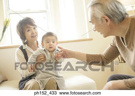 Close-up of a senior couple with their grandson View Large Photo Image Stock Image - Close-up of a senior couple with their grandson. Fotosearch